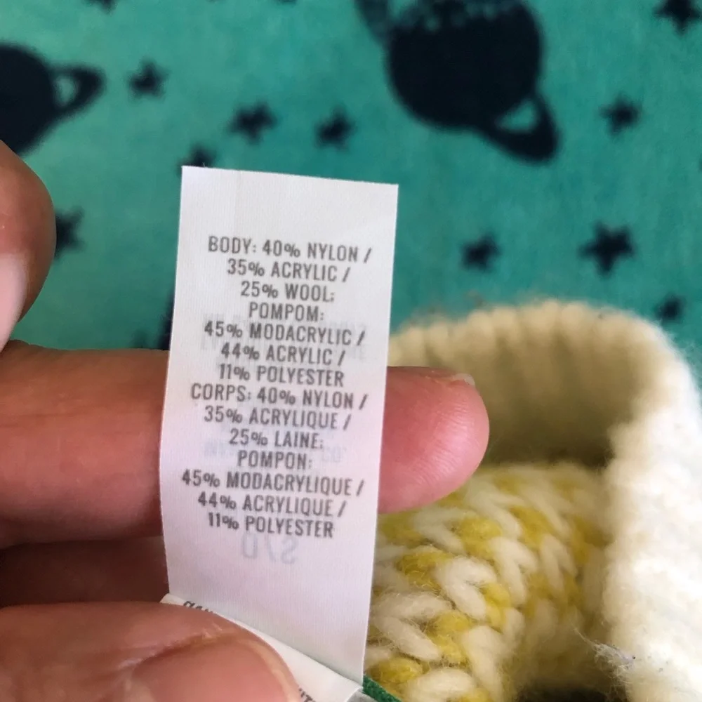 eerie off white and yellow beanie with pompom one size fits most